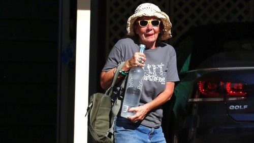 Corby's aunt Jen arrives at the home with a bottle of vodka. (AAP)