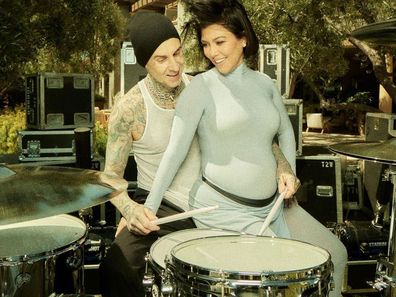 Kourtney Kardashian and Travis Barker, pictured at their gender reveal, have hinted their unborn son might be named Rocky.