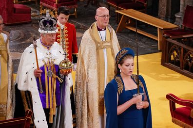 Lord President of the Council, Penny Mordaunt, holding the Sword of State walking ahead of King Charles III during the Coronation of King Charles III and Queen Camilla on May 6, 2023 in London, England.  