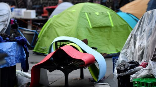 Dozens of tents have been erected in the CBD forecourt since December with the number continuing to grow despite attempts by authorities to move people on. (AAP)