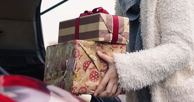 Christmas 2022 shopping placing gifts in car