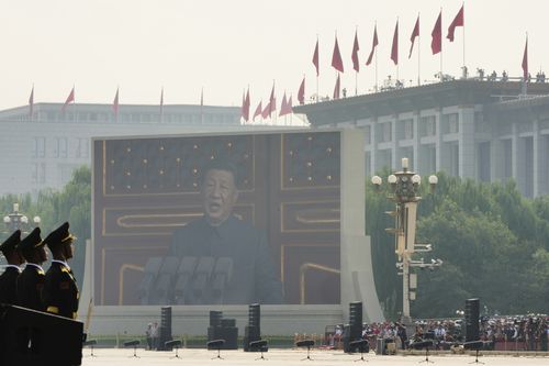 Chinese President Xi Jinping is seen speaking on a giant screen ahead of the military parade.