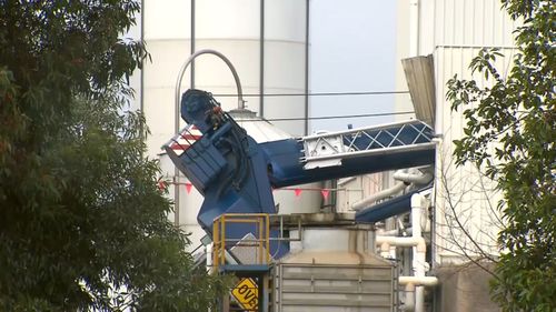 A crane has collapsed onto a factory in Dandenong South.