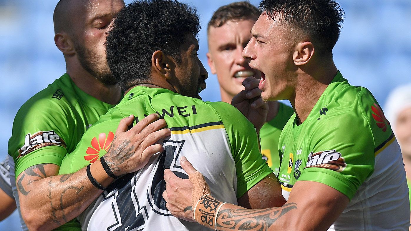 Iosia Soliola of the Raiders is congratulated by team mates after scoring a try during the round 2 NRL match between the New Zealand Warriors