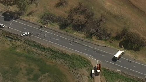 The crash caused debris from both vehicles to be strewn across a long stretch of the highway. (9NEWS)