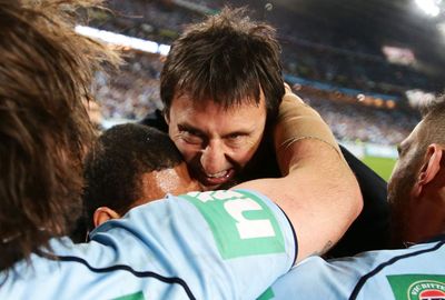 Laurie Daley celebrates the victory with his team.