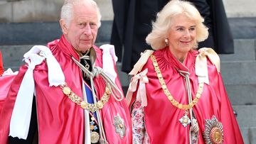 King and Queen wear traditional robes for service