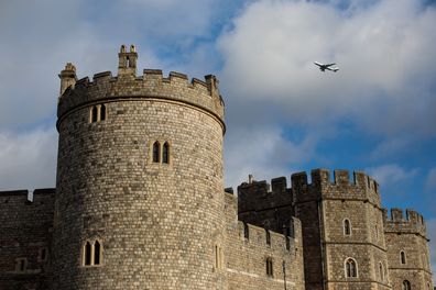 A plane flies over Windsor Castle on January 5, 2018 in Windsor, England.