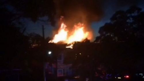 Thick black smoke and flames at least three metres high could be seen (9NEWS)