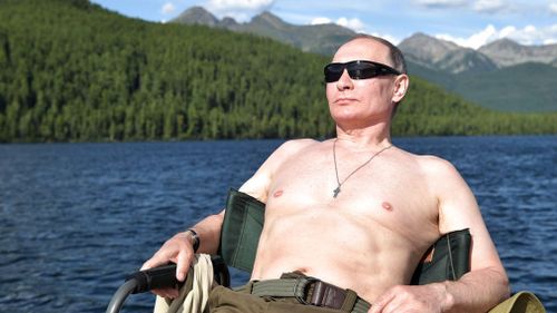 Russian President Vladimir Putin rests after fishing during a mini-break in the Siberian Tyva region. (AP)
