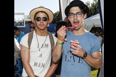 Jonas Brothers' Nick & Joe keep it casual at Coachella's LACOSTE L!VE 4th Annual Desert Pool Party.
