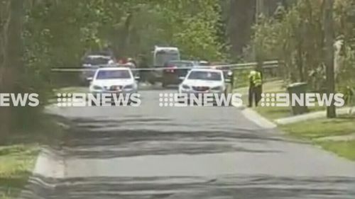 Police vehicles at the scene on Kings Road. (9NEWS)