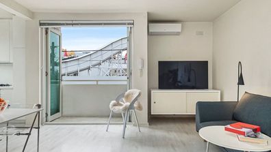 The rollercoaster swoops past the balcony at 10/19 Shakespeare Grove, St Kilda apartment Domain affordable