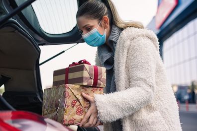 Putting Christmas gifts in boot of car