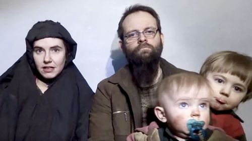 Caitlan Coleman talks in the video in December 2016 while her Canadian husband Joshua Boyle holds their two children. (AAP)