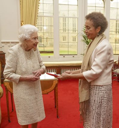 WINDSOR, ENGLAND - MARCH 16: Queen Elizabeth II presents the Queen's Gold Medal for Poetry to Grace Nichols during a private audience at Windsor Castle on March 16, 2022 in Windsor, England. (Photo by Steve Parsons - WPA Pool/Getty Images)