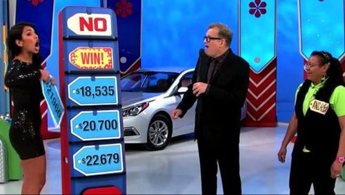 Model Manuela Arbelaez accidentally reveals the winning card to Price Is Right host Drew Carey and contestant Andrea. (Supplied)