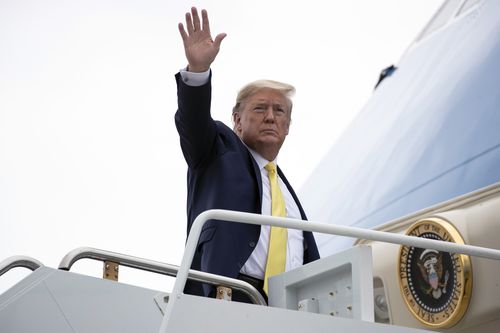 President Donald Trump waves as he boards Air Force One upon departure at the Orlando Sanford International Airport, Monday, March 9. Picture: Alex Brandon