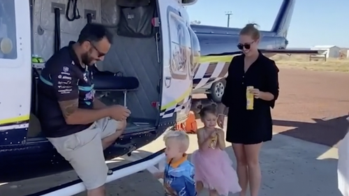 Drinks and iceblocks were handed to the family after they arrived in Coober Pedy.