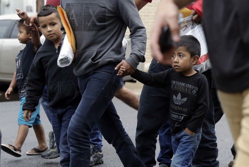 Young immigrants with their parents after being processed by U.S. Customs and Border Protection. Picture: AAP