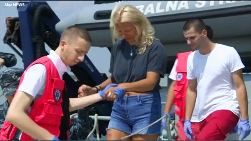 Croatia's coast guard says a British woman has been saved after spending 10 hours in the Adriatic Sea at night after she fell from a cruise ship.