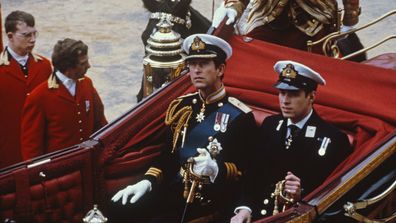 Charles, Prince of Wales and his brother Prince Andrew make their way by coach to St Paul's Cathedral, for Charles' wedding to Lady Diana Spencer, London, 29th July 1981