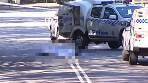 Police spent the night scouring the streets around Forest Lodge after nearby workers discovered a man's body in the middle of the road in daylight yesterday.