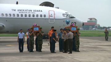 The first two coffins containing victims' bodies from AirAsia flight QZ8501 have arrived at Lanudal Airbase in Surabaya. (BSkyB)