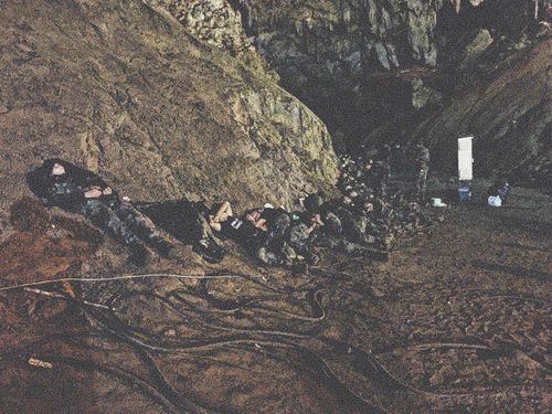 Some of the volunteers take a break after finding the trapped boys in the cave. Picture: Harbor Pattaya