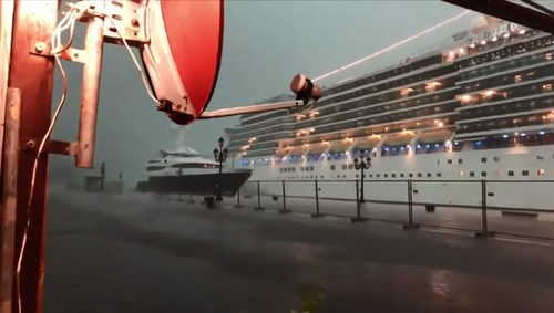 A cruise ship in Venice almost hit a smaller yacht during a freak hail storm on Sunday.