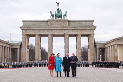 First Lady Elke Buedenbender, Camilla, Queen Consort, King Charles III and German President Frank-Walter Steinmeier arrive for a Ceremonial welcome at Brandenburg Gate on March 29, 2023 in Berlin, Germany. 