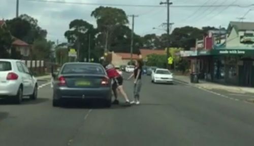 Man and woman filmed attacking a car and its driver in a Sydney street. 