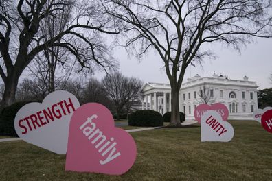 A Valentine's Day decoration, signed by first lady Jill Biden, sits on the North Lawn of the White House.