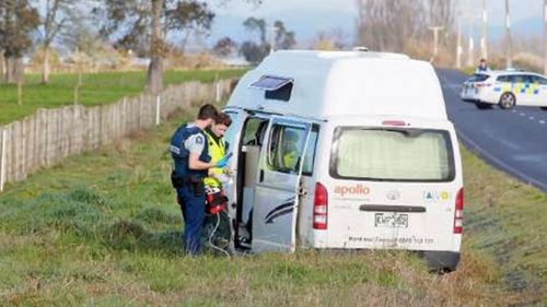 Police inspect a campervan after an Australian tourist was allegedly shot dead.