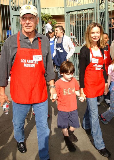 Actor Harrison Ford and actress Calista Flockhart with son Liam participate in serving Thanksgiving dinner to the Skid Row homeless at the Los Angeles Mission hosted by Kirk Douglas and Anne Douglas on November 21, 2007 in Downtown Los Angeles, California. 