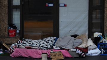 A homeless person sleeps in Sydney&#x27;s CBD.