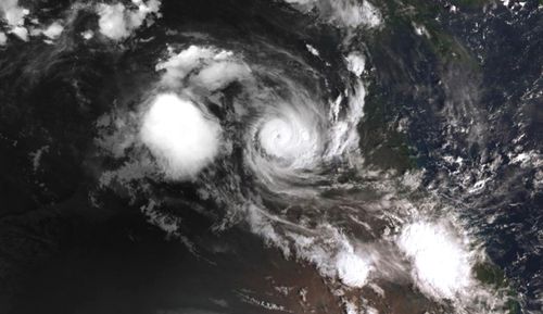 Cyclone Owen is rapidly gathering strength over the warm waters of the Gulf of Carpentaria with forecasters still expecting it to cross the coast on Friday. 