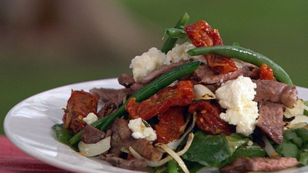 Barbecue beef sirloin with oven dried tomatoes, persian fetta and rocket salad