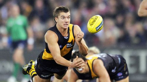 Dustin Martin gets tackled by David Mundy of Fremantle during their AFL game at Etihad Stadium in Melbourne on July 10, 2010. (AAP)