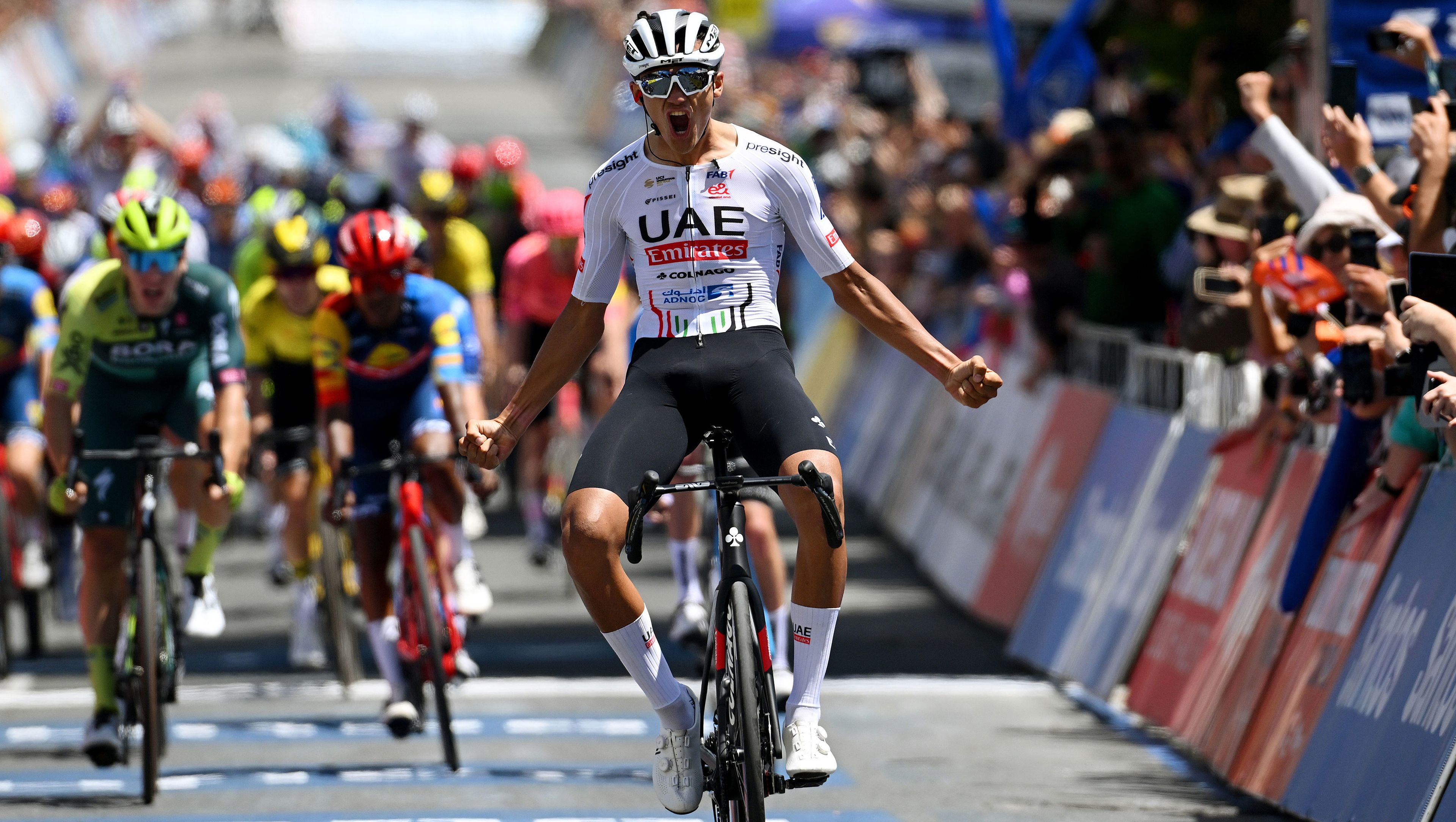 Isaac Del Toro Romero of Mexico and UAE Team Emirates celebrates at the finish line as stage winner aftr stage two of the 24th Santos Tour Down Under. 