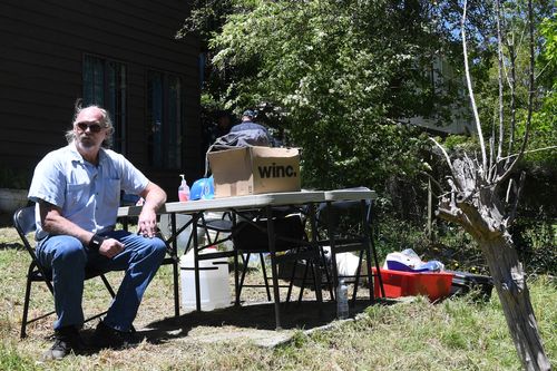 Mark Wearne, father of Belinda Peisley, sits at the scene waiting for news from the dig.