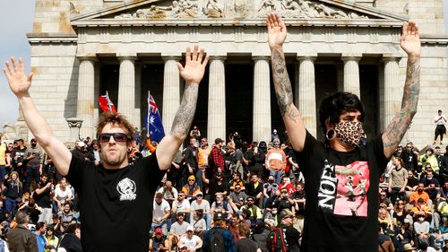 Protesters are seen at the Shrine of Remembrance on September 22, 2021 in Melbourne, Australia. Protests started on Monday over new COVID-19 vaccine requirements for construction workers but turned into larger and at times violent demonstrations against lockdown restrictions in general. Melbourne is currently subject to COVID-19 lockdown restrictions, with people only permitted to leave home for essential reasons. (Photo by Darrian Traynor/Getty Images)