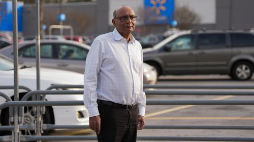 Mahendra "Mick" Patel stands outside a Walmart store in Kennesaw, Georgia on December 17.