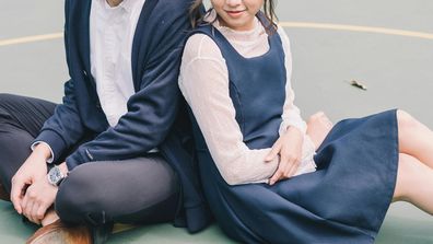 Stock image of a young couple on the playground.