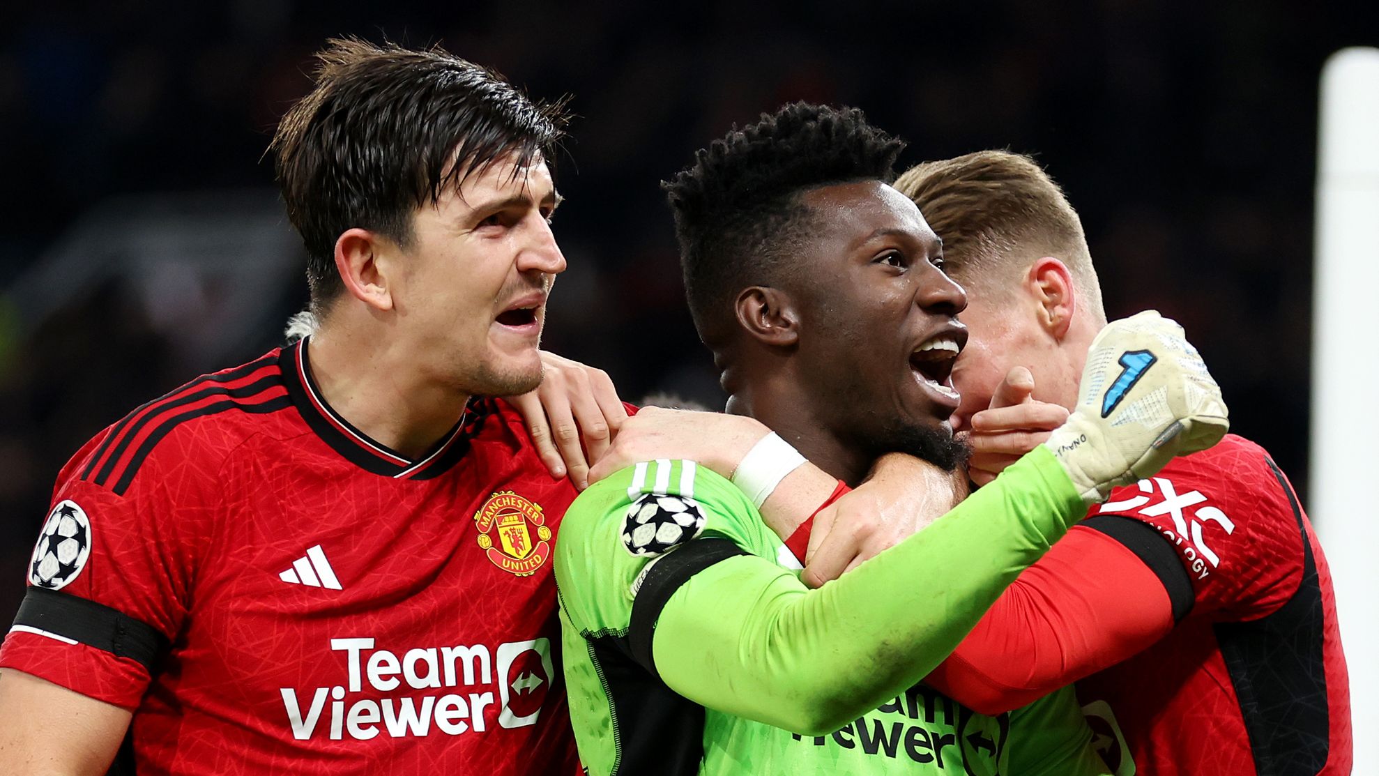 Andre Onana and Harry Maguire of Manchester United celebrate after saving a penalty from Jordan Larsson of FC Copenhagen during the UEFA Champions League match at Old Trafford.