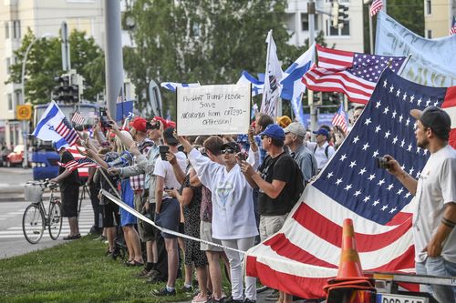 Big crowds have cheered on the president as he drove past. Picture: AAP