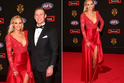 The partner of Saints star David Armitage wore a red frock. (Getty)