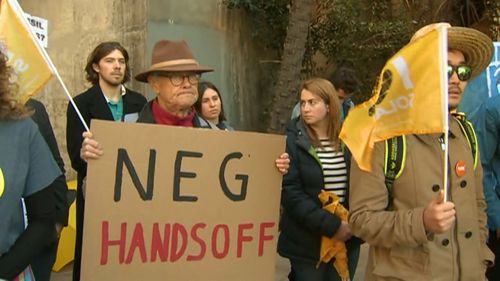 Protesters outside the ministers' meeting.