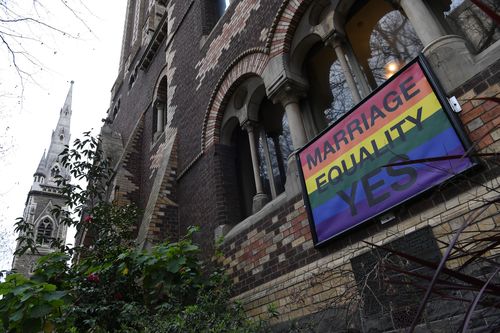 A marriage equality sign posted outside St Michael's Uniting Church  in the Melbourne CBD last year. Picture: AAP 