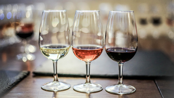 Wine tasting: glasses of white, rose and red wine